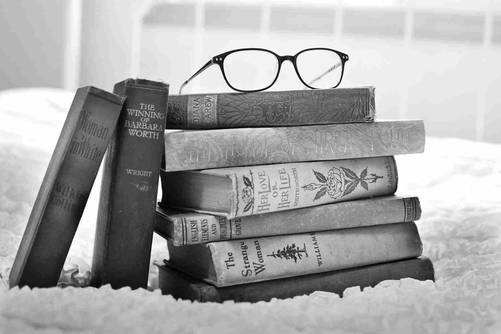 glasses on stack of books