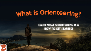 what is orienteering? Learn what orienteering is and how to get started! Featured image. Man hiking over cliff at night. overlooking water.