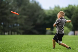 frisbee, team sport, child throwing frisbee