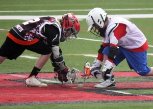 2 players playing lacrosse, team sports