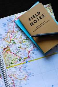 map and notebook, navigate