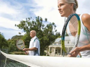 2-older-people-playing-tennis, doubles play