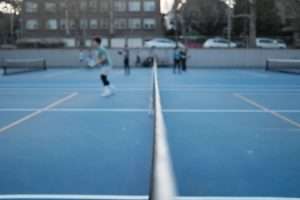 tennis court, people playing pickleball